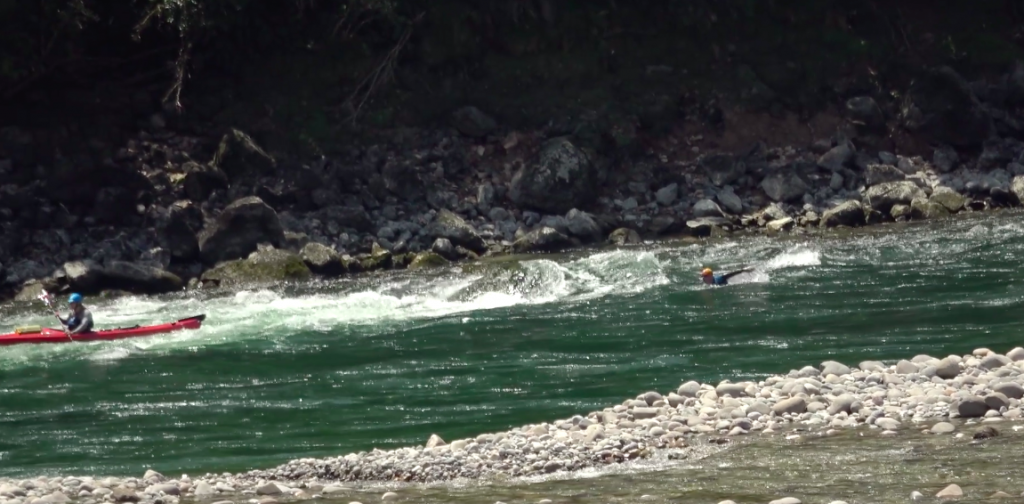 Rob Hutchings swimming rapids in the Buller River